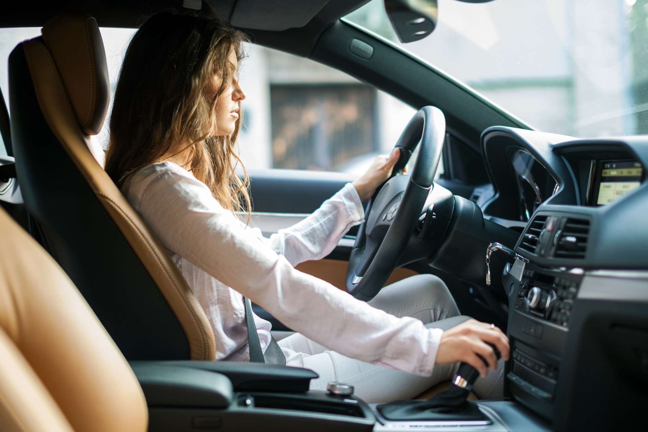 Woman driving her car intensely
